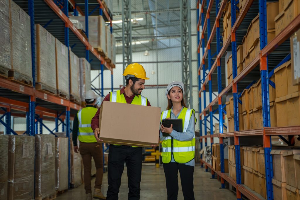 Warehouse worker checking in warehouse.